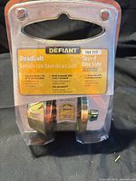 Front of sealed retail package showing Defiant brand and product details