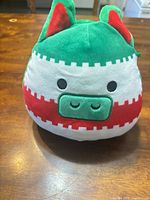 Front view of Enrique plush showing stripe colors, face and ears