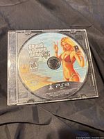 Front view of disc in clear slim jewel case showing printed label