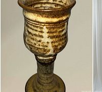 Side view of stoneware chalice showing glaze and slip decoration