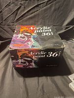 Closed carton showing branding and 36-color label