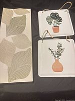 Canvas leaf print and two plant plaques overview