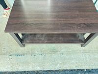 Top view showing rectangular espresso tabletop and lower shelf