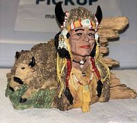 Front view of resin bust showing chief, buffalo figures, and rock base