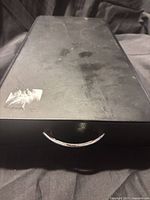 Top view of closed black metal drawer