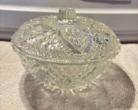 Side view of lidded pressed glass candy dish