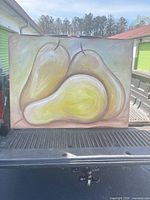 Front view of the painting showing three pears imagery