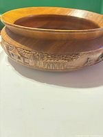 overall view showing bowl profile and carved scene