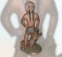 Front three-quarter view of figurine showing overall design and paint