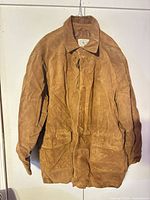 Full front view of brown suede jacket on hanger