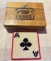 Closed wooden box with etched logo and silver tie
