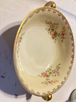 Top view showing floral pattern and gold rim