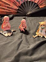 Overview of all three figures on black cloth