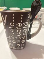 Side view showing exterior graphics, handle slot, spoon inserted