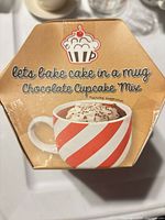 Front of boxed gift set showing mug image and product name