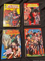 All four manga volumes front covers visible