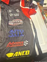 Front panel showing Service Champ, Auto Data, Advance Professional, ANCO logos and button front