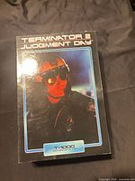 Front flap closed; shows helmeted T-1000 image on box front