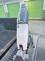 Full rear/side view of Oreck Rinse-A-Matic Steemer showing body, tanks, wheels, cord