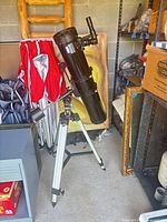 Full view of telescope on equatorial mount with tripod and counterweight