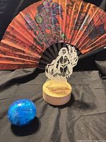 LED night light, illustrated fan, blue Bandai capsule toy displayed together