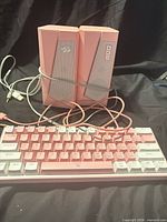 Keyboard and both speakers on surface, showing overall lot