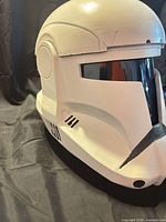 Left front angle of helmet showing visor, brow ridge and side vent