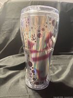 Front view of clear double-walled tumbler showing Coca-Cola and Royal Caribbean graphics
