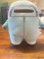 Rear view of Jinbe plush showing zipper accent