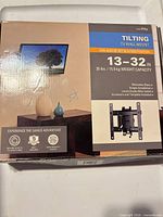 Front of box showing product image and specs 13–32 in, 35 lb