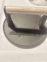 Top view showing embossed Tommy Bahama logo and wooden handle