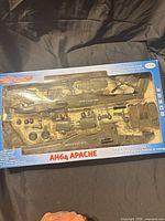 Front of boxed True Heroes AH-64 Apache kit showing unassembled parts in window