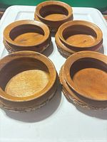 Five teak bowls showing size and quantity