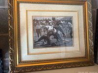 Full view of framed autograph photograph