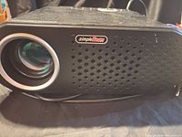 Front view of ViviBright GP90 projector showing lens and SimpleBeam grille