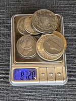 All coins on scale showing weight 87.20 g