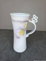 Full view of mug showing glaze colours and handle detail