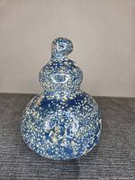 Front view of blue speckled double-gourd ceramic sculpture