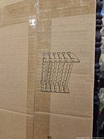 close-up of box with printed outline of rack