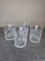 Four cut glass whisky tumblers grouped