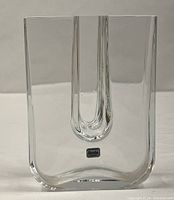 Front view of clear U-shaped vase with Boda sticker