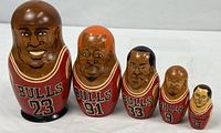 Full set of five Bulls nesting dolls lined up by size