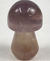 Front view of polished crystal mushroom figurine