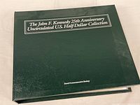 Front cover of green binder showing full title