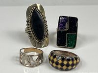 Front view of all four rings displaying designs