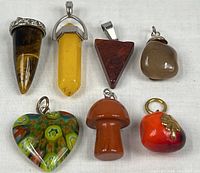 Seven pendants displayed