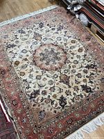 Full view of Tabriz rug showing entire pattern and size