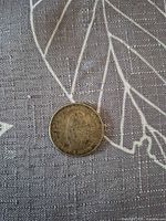 Reverse side with Cuban coat of arms and denomination