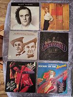 Front covers of all six vinyl LPs