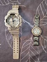 Front view of both watches side by side